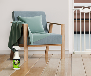 Keep Off spray bottle next to armchair.
